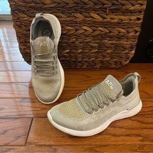The APL Techloom Breeze Women's Gold and Silver Running Shoes size 6.5.